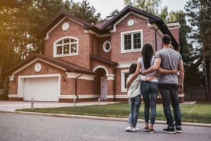 Family admiring their new home